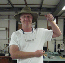 Will Jaeckle proudly displaying his first sailfish (collected as larva and contained within the pipette) taken from the western Atlantic Ocean.
