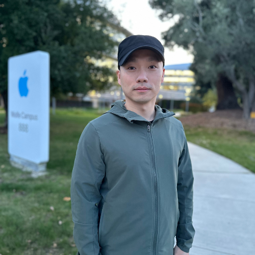 Qing Ding standing in front of Apple Headquarters