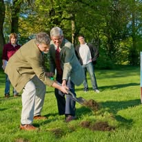 President Richard Wilson and Doug Faulkner of the Institute turn the first shovel