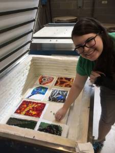 student in kiln room