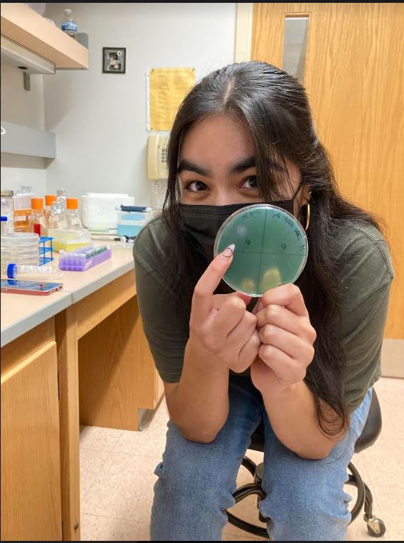 Joselyn Molinar poses with a petri dish