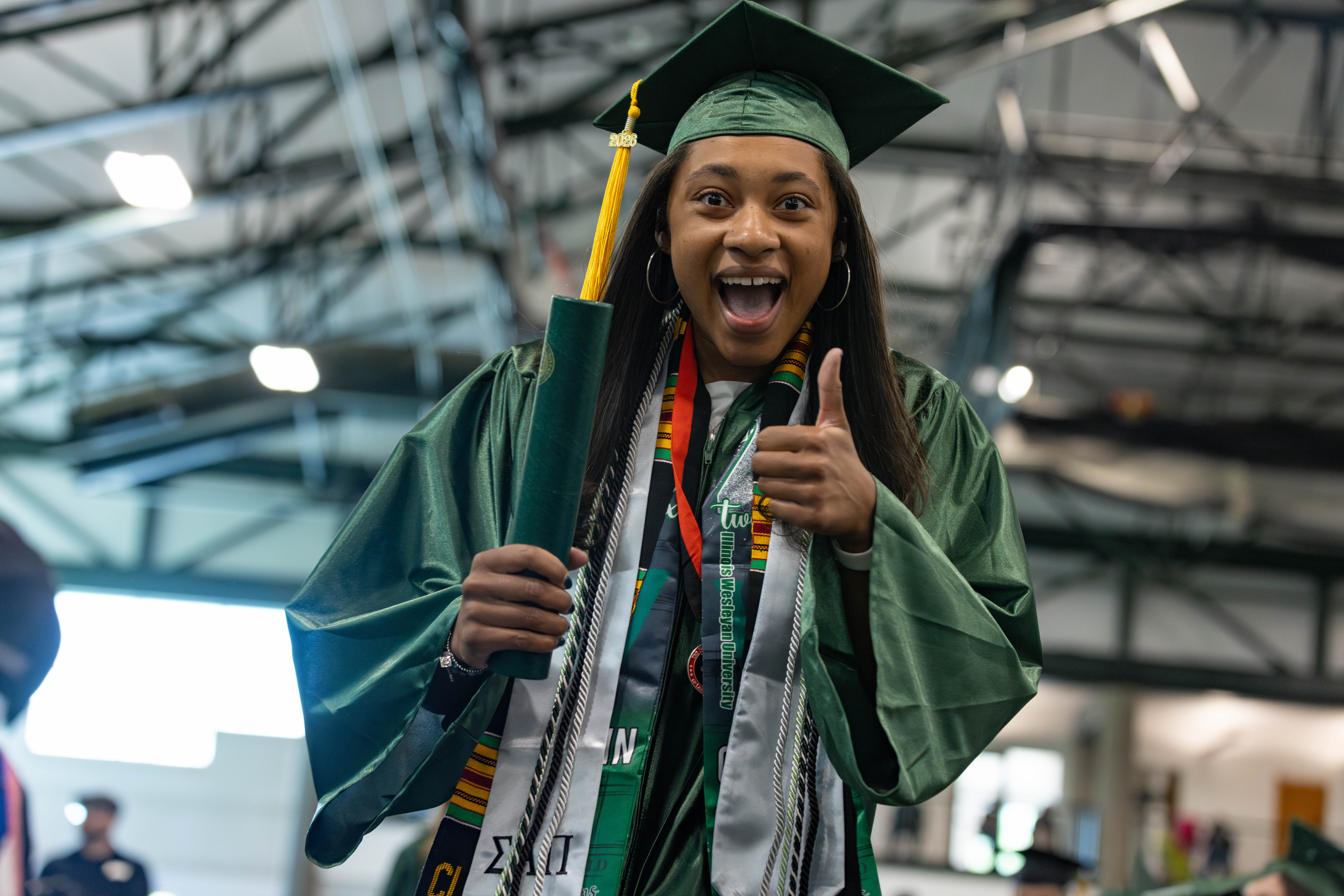Student during Commencement with diploma