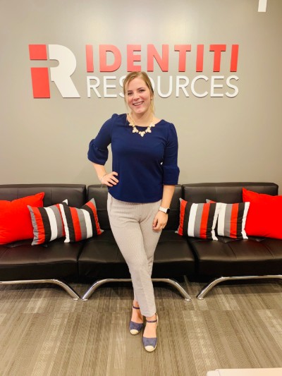 Isabel with the Identiti logo