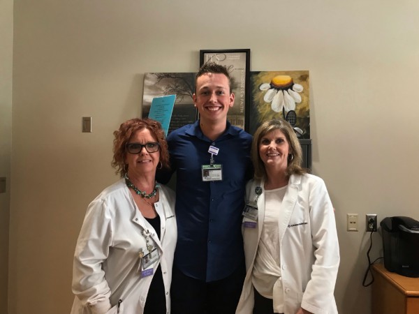 kyle with 2 nurses