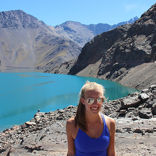 Kaitlyn by a lake in the mountains