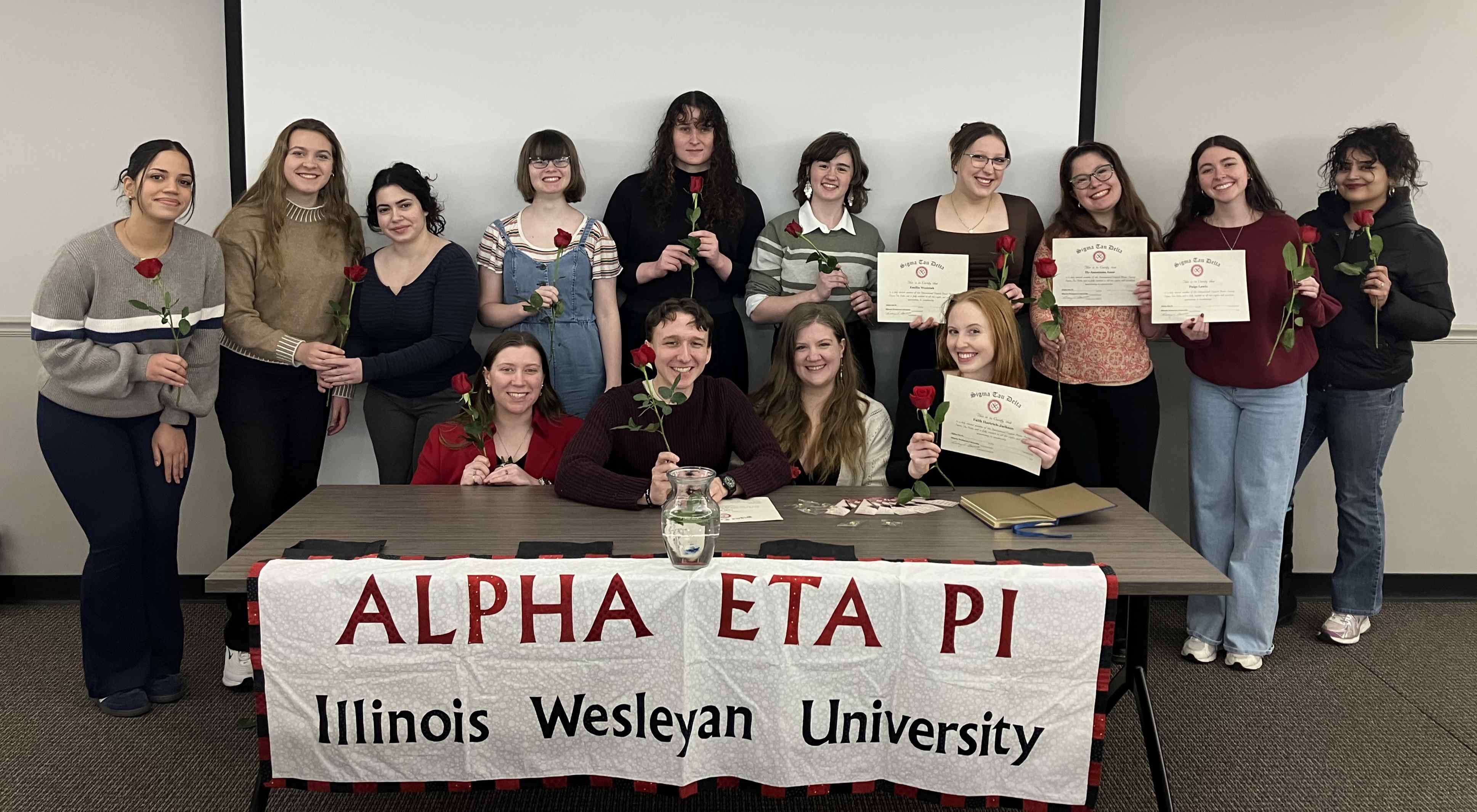 Sigma Tau Delta students with certificates