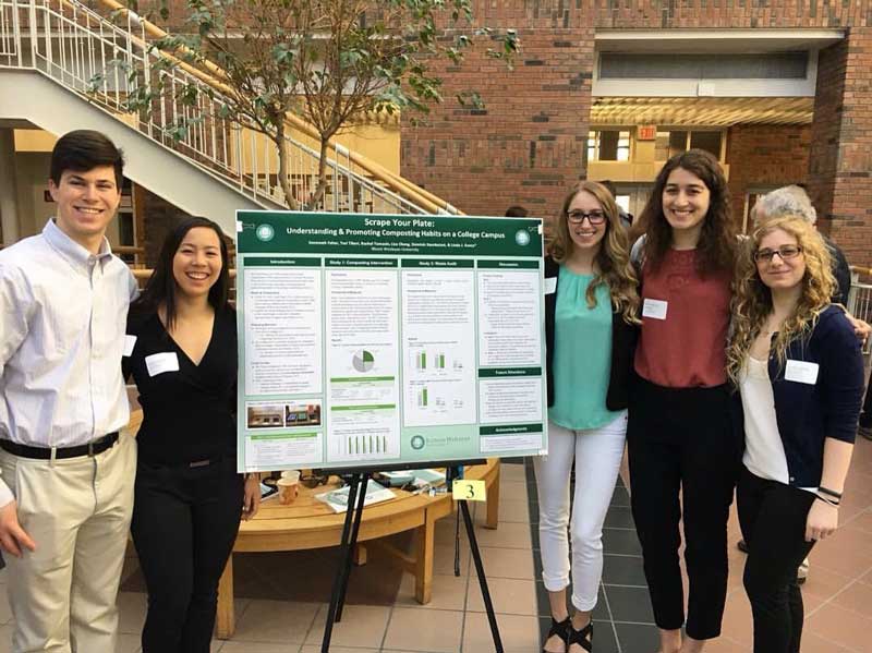 Students present their work on campus composting at the John Wesley Powell Research Conference.