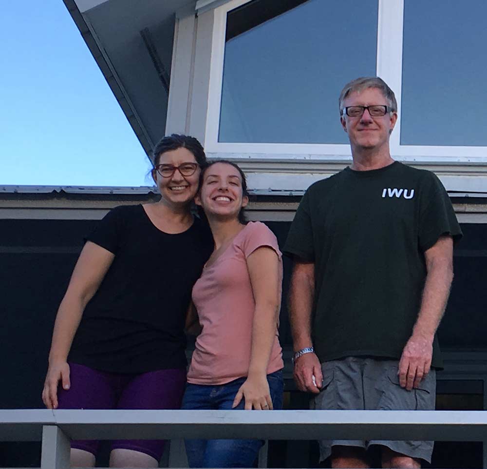 Members of the STREAMCODE research team (from left) Stephanie Bush ’02, Jamie Blumberg ’19 and IWU Professor of Biology Will Jaeckle pose on the balcony of the Tyson House, the living quarters for visiting researchers. 
