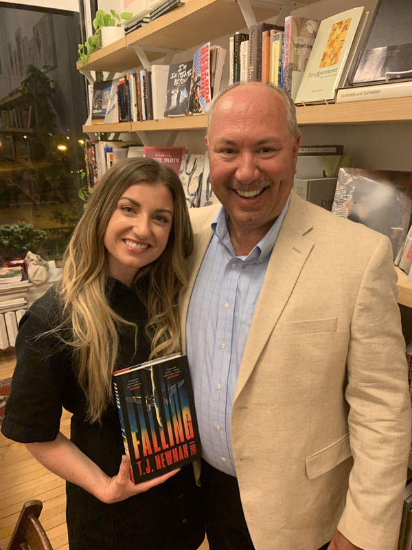 Newman visits with Bob Murray ’82 at a book signing event in Chicago. Murray recruited Newman to Illinois Wesleyan at a college fair in Phoenix two decades ago.