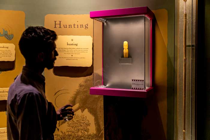 A visitor at the Museum of the Cherokee Indian observes a piece from the “Disruption” exhibit. Photo credit: Museum of the Cherokee Indian. 
