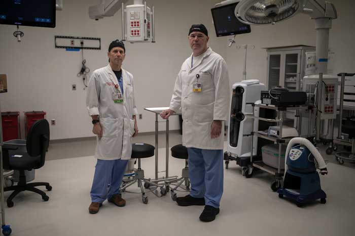 Tim Pritts ‘91 (right) with his colleague William Knight in the UC Medical Center. Photo credit: Maddie McGarvey/The New York Times