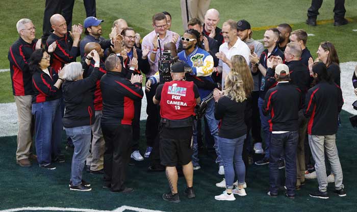The medical professionals who treated Hamlin, including Tim, were honored on the field before the Super Bowl, where they had a chance to catch up with Hamlin and the Buffalo Bills team. Photo credit: Shutterstock.
