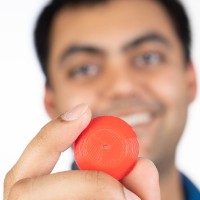 Niyant holding a 3D printed electrode 