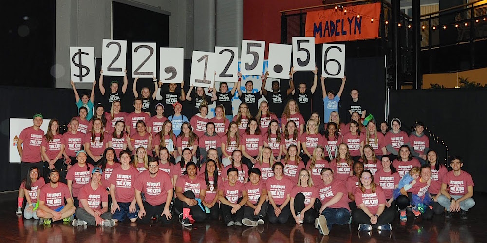 TitanThon raised $22,125.16 in Dalton's final year as president of the organization, and participators pose in front of the final total.