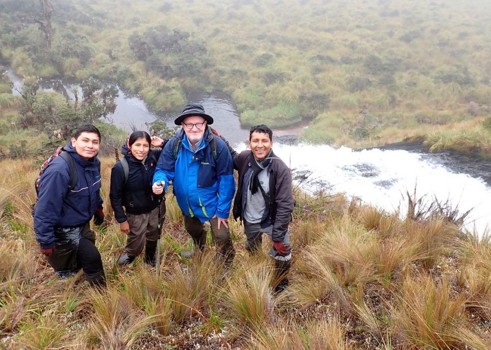 Edgar Lehr and research team by waterfall in peru