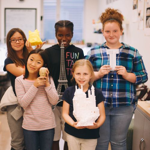 Girls holding 3D printed objects from previous MakerGirl Academy