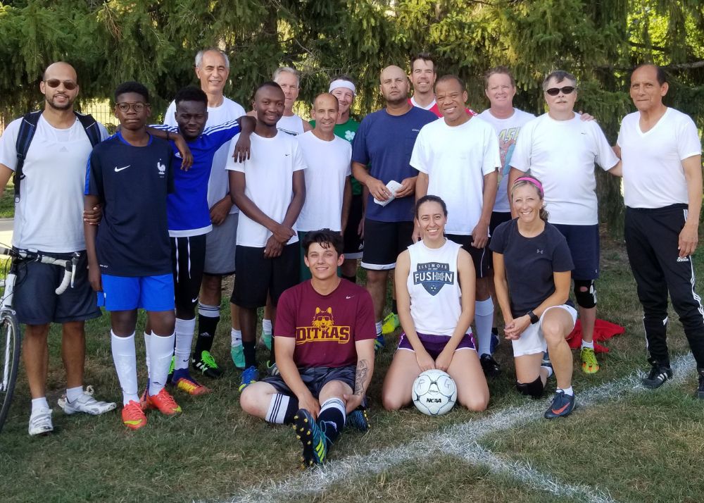 Soccer players gather on field after game