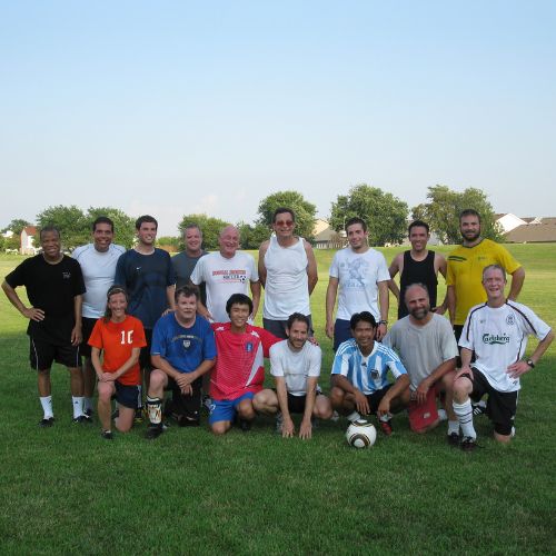 Members of soccer team gather on field after game