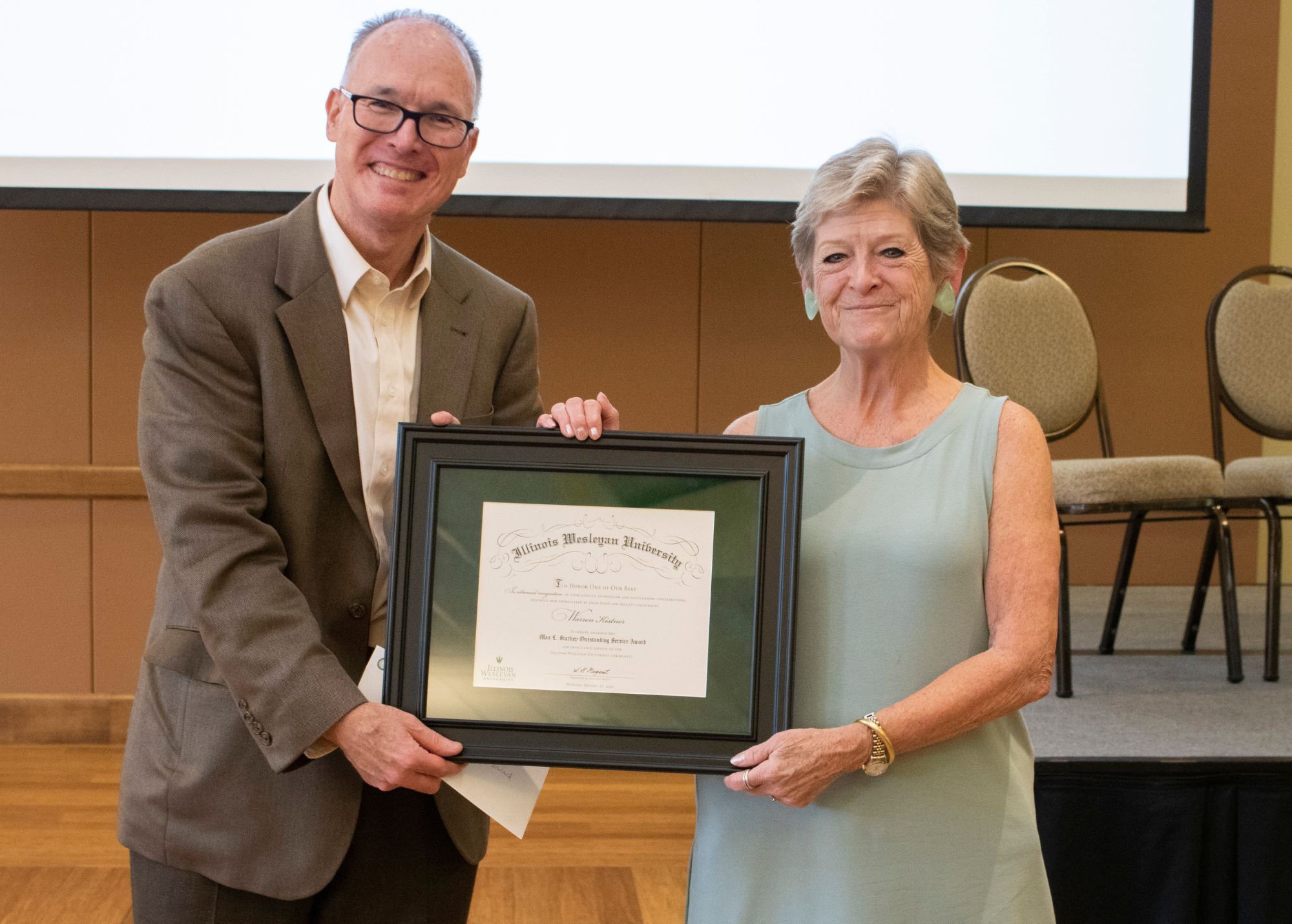 Warren Kistner and President Nugent with certificate