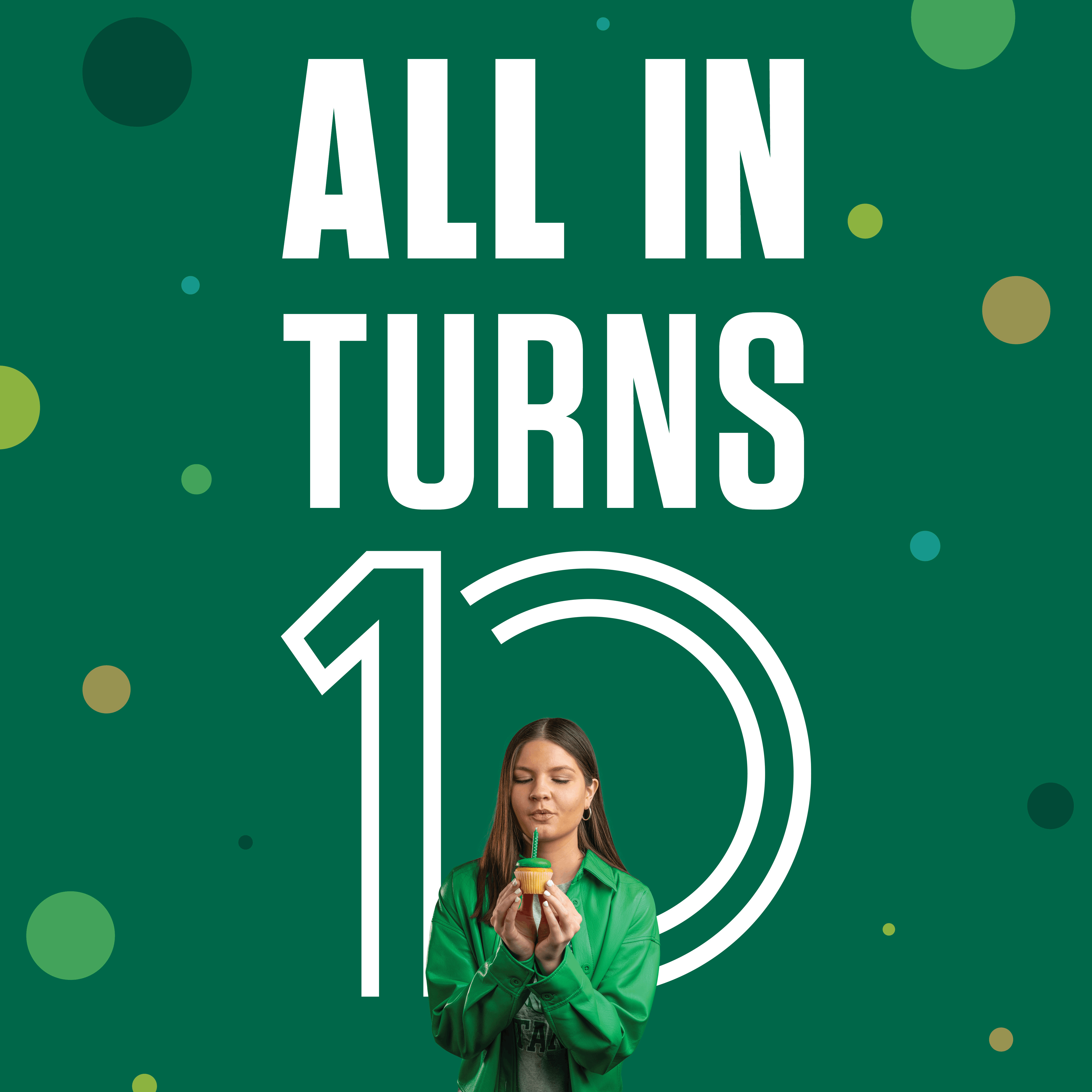 Illinois Wesleyan student blowing out candle on green cupcake in front of text "all in turns 10"