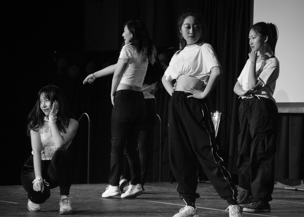 Cypher Dance Team members performing on stage