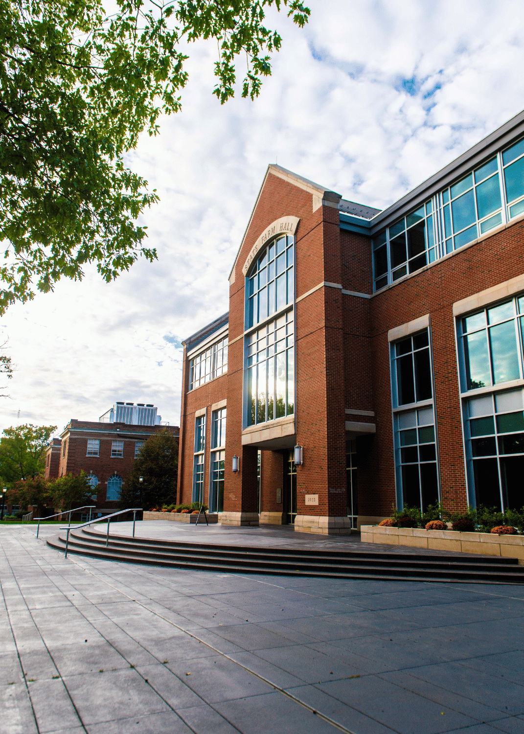 South side of State Farm Hall framed by trees