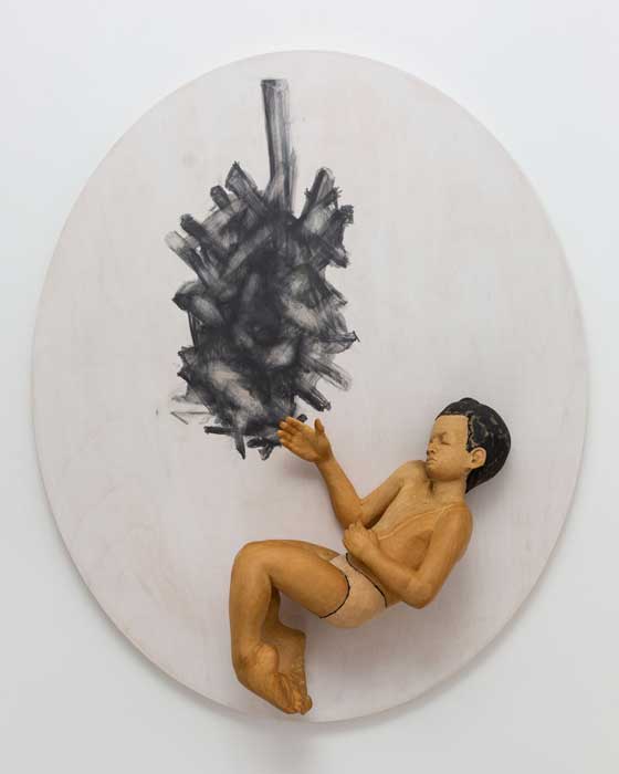 Wood sculpture of human figure by artist Santiago Cal
