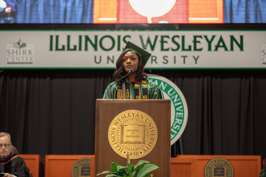 Franchesca Smith Commencement Franchesca Smith '25 speaks at podium on stage during 2025 IWU commencement