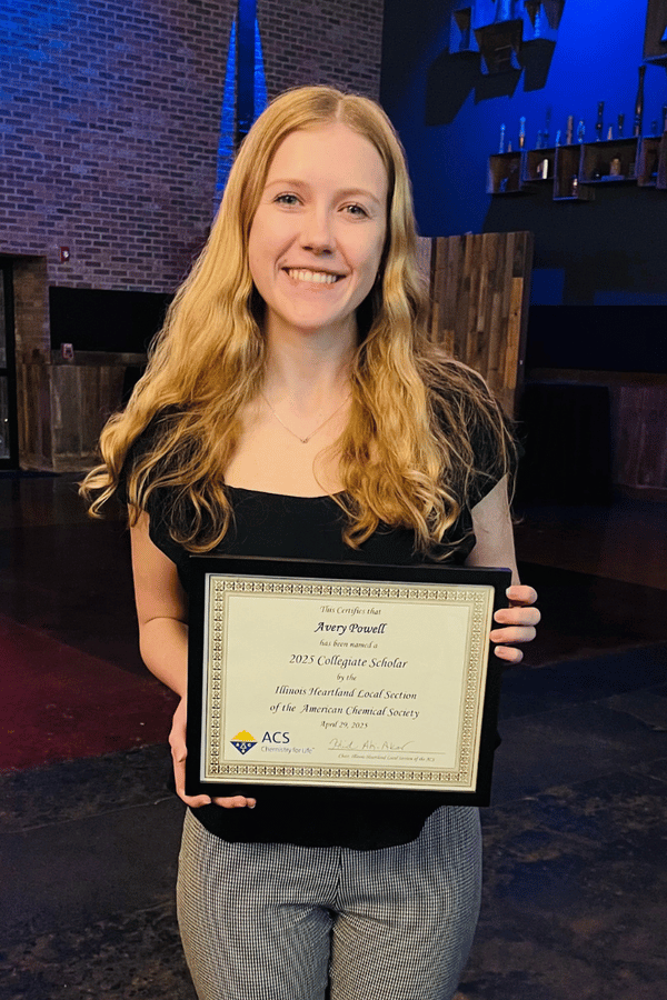 IWU student Avery Powell with certificate