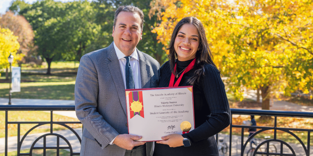 Illinois Wesleyan student Valeria Suarez with President Sheahon Zenger, holding Lincoln Laureate Award
