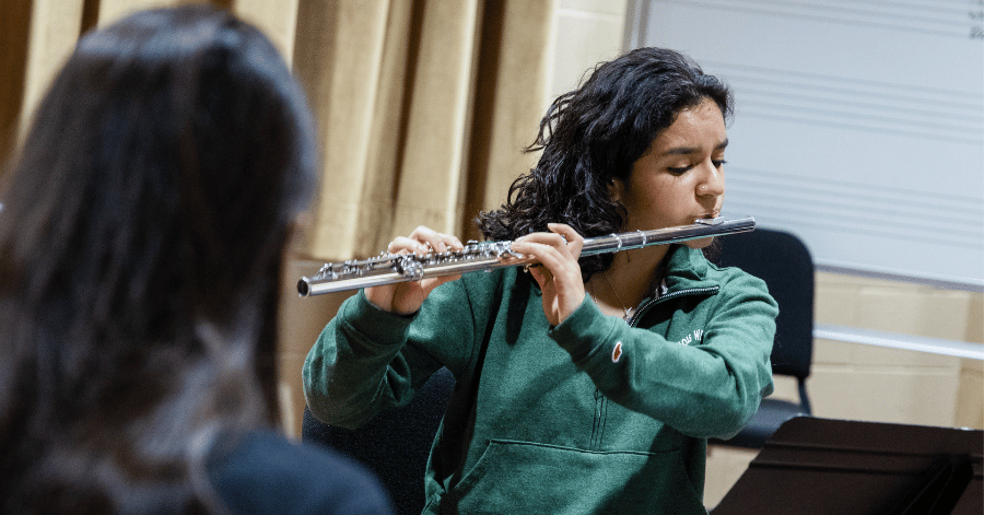 IWU student playing a flute