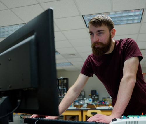Ben Heinz working at the computer. 