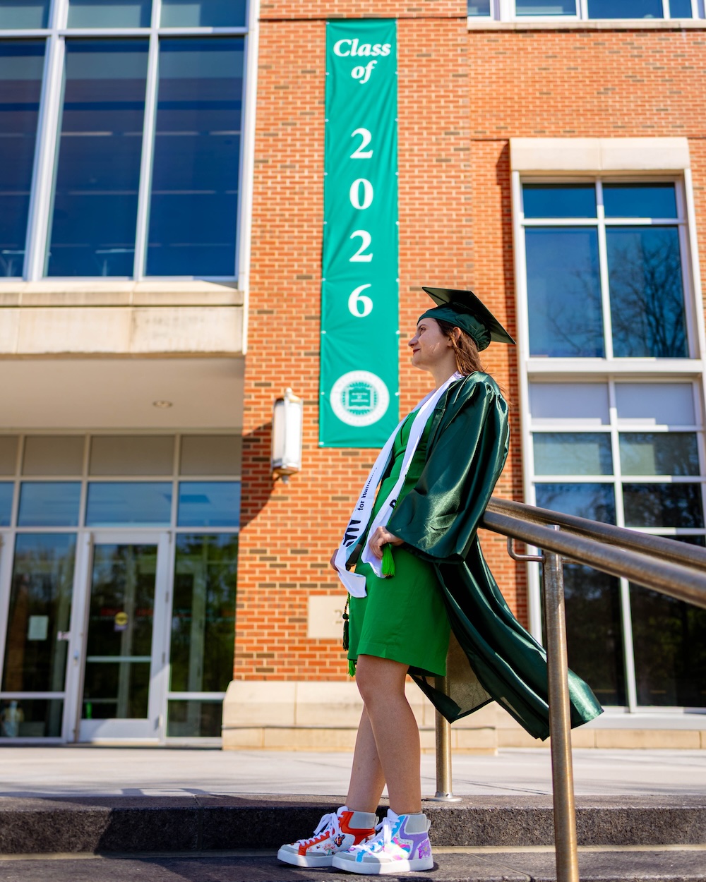 Student commencement speaker Chlose Shapkauski standing in front of State Farm Hall.