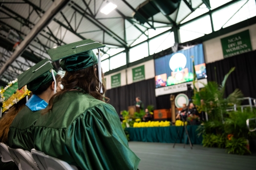 Students viewing stage at IWU commencement