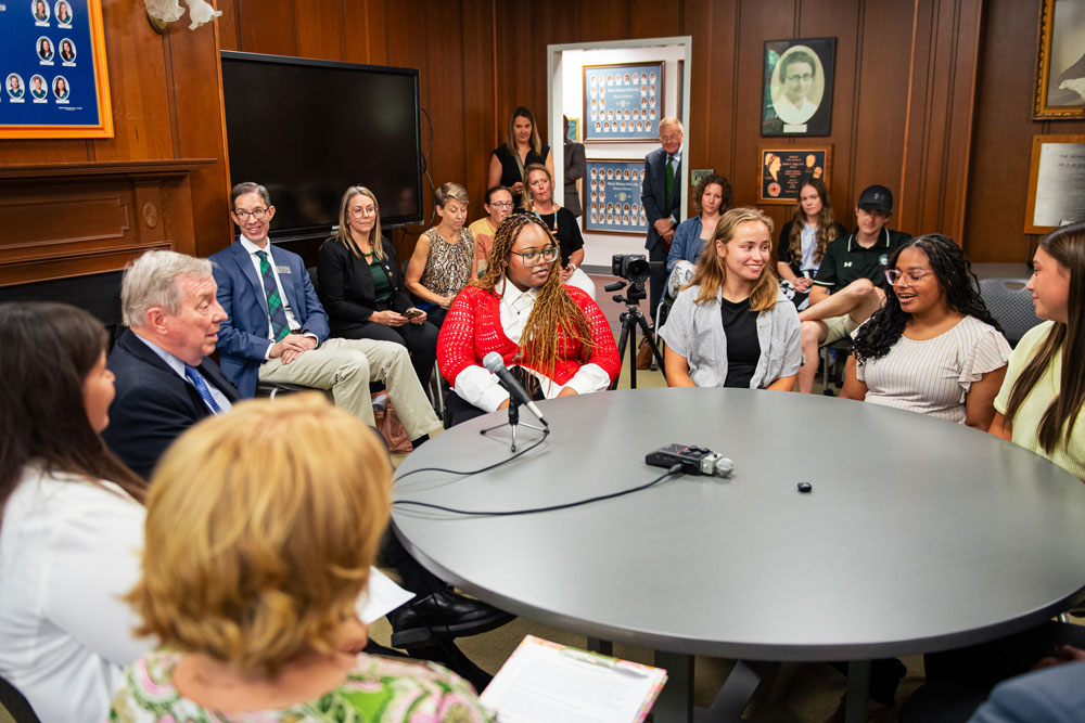 Durbin with students at round table