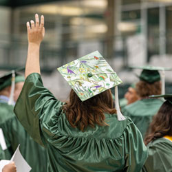 Grad with raised hand