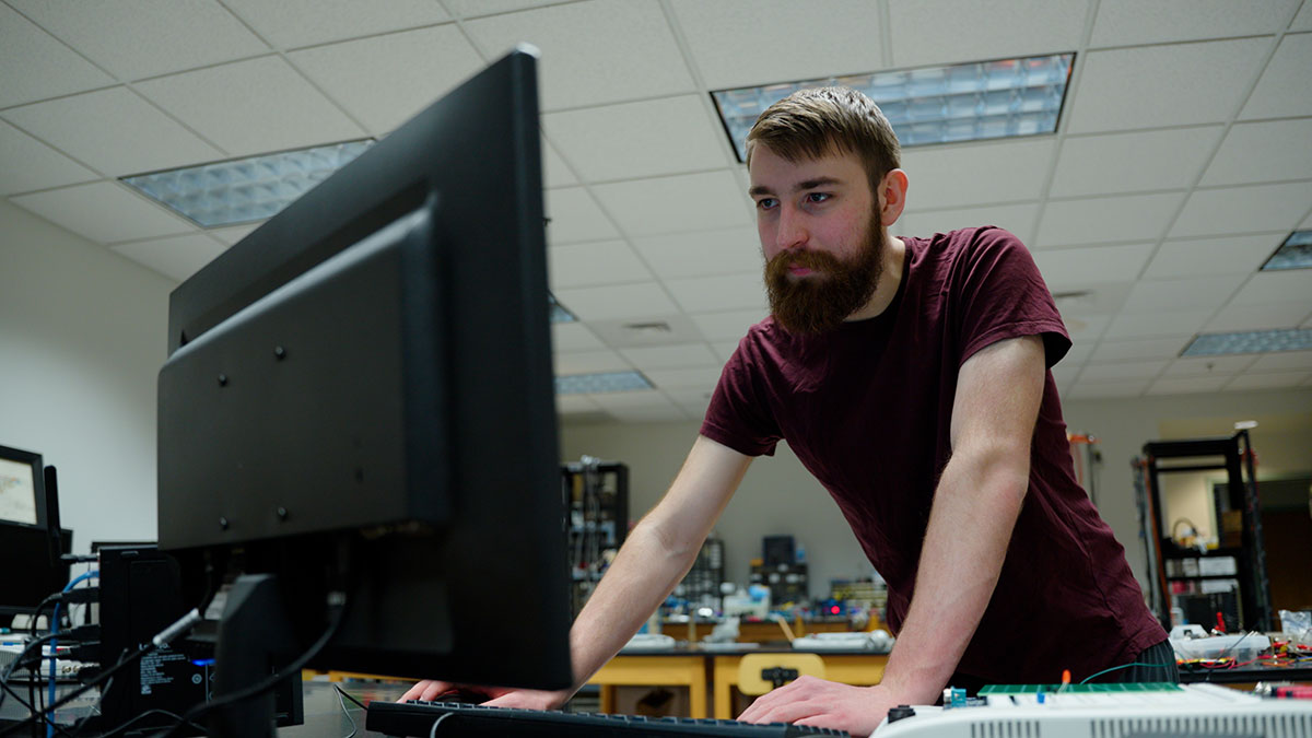 Ben Heinz working at the computer.
