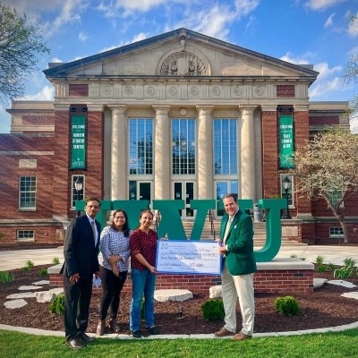 For a Better Tomorrow presents President Zenger with scholarship funds