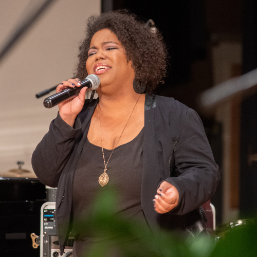 Woman singing at IWU Gospel Fest