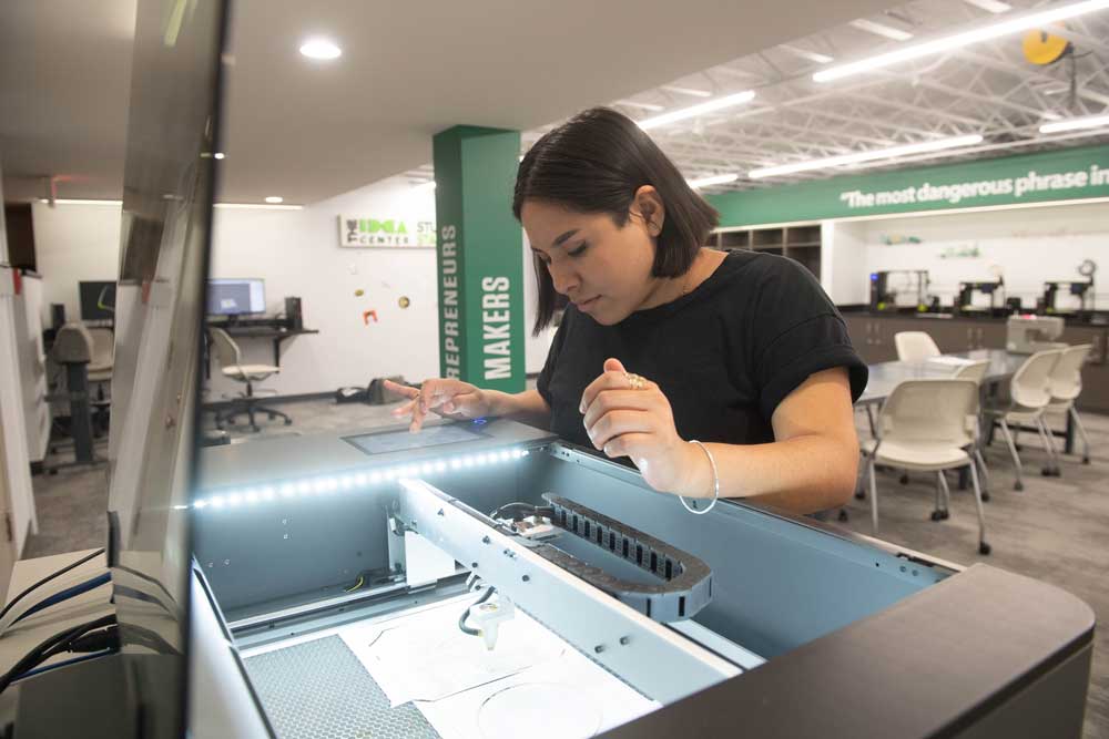 A student uses equipment in the curent IDEA Center makerspace. 
